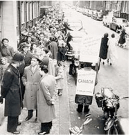 Crowds queue up outside the Canadian government Immigration office in London, England, during the 1956 immigration rush.